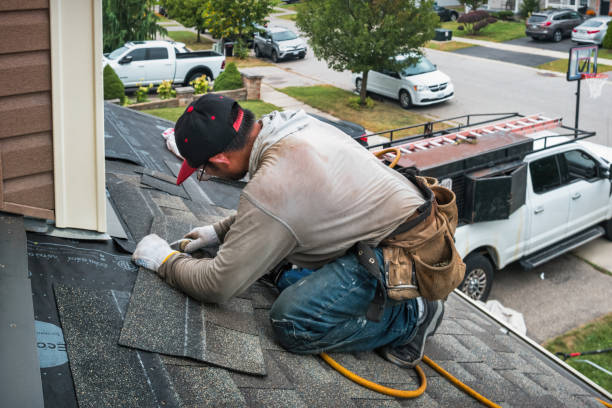 Professional Gutter Installation technician working in Walpole, MA
